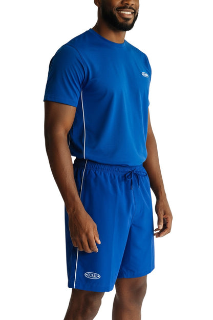 RISE Guard Male Flex Board Short in royal blue, shown on model